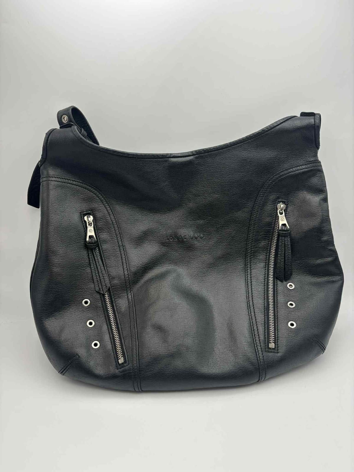 Sac Longchamp Ladbroke en cuir noir après les soins réalisés dans notre atelier